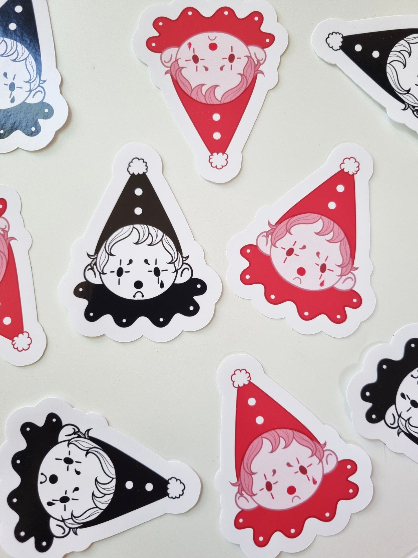 The Sad Clown | Glossy Clown Sticker - EmilsDoodles
On a white background, both sticker styles are scattered around.