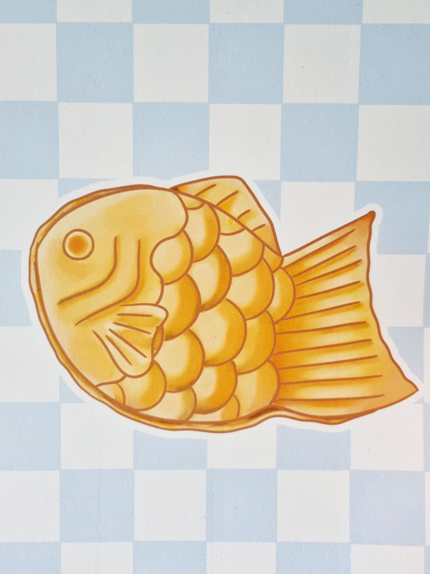 A close up showing the entirety of the golden brown taiyaki.