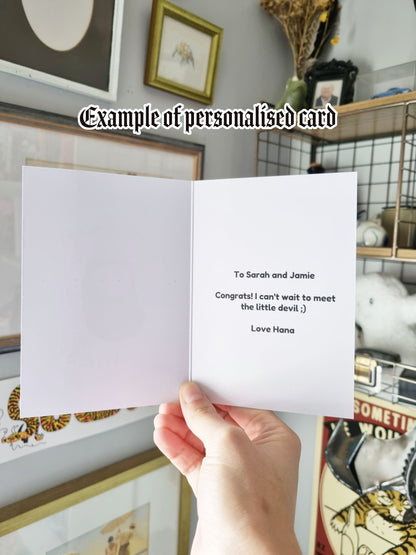 An example of a personalised card. Which reads: To Sarah and Jamie, Congrats! I can't wait to meet the little devil ;) Love Hana.