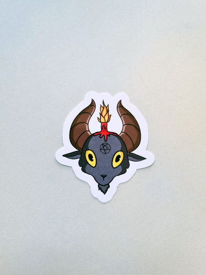A sticker of Baphomet on a grey background.