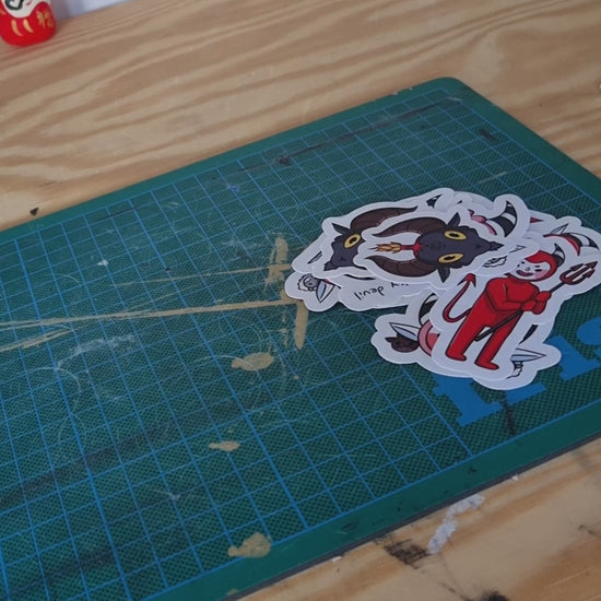 A video of someone assembling a sticker pack